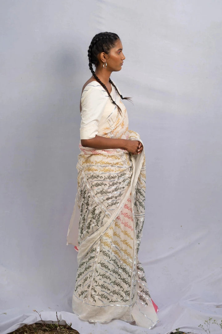 Ilamra kalamkari craft hand block printed organic cotton Pebble white base with orange, pink, lime green and dirty green motifs saree