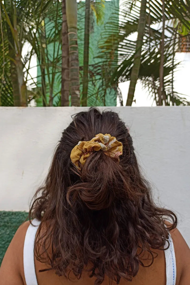 ilamra hand block printed naturally dyed organic cotton Mustard yellow, hints of dirty green and red upcycled cotton scrunchie