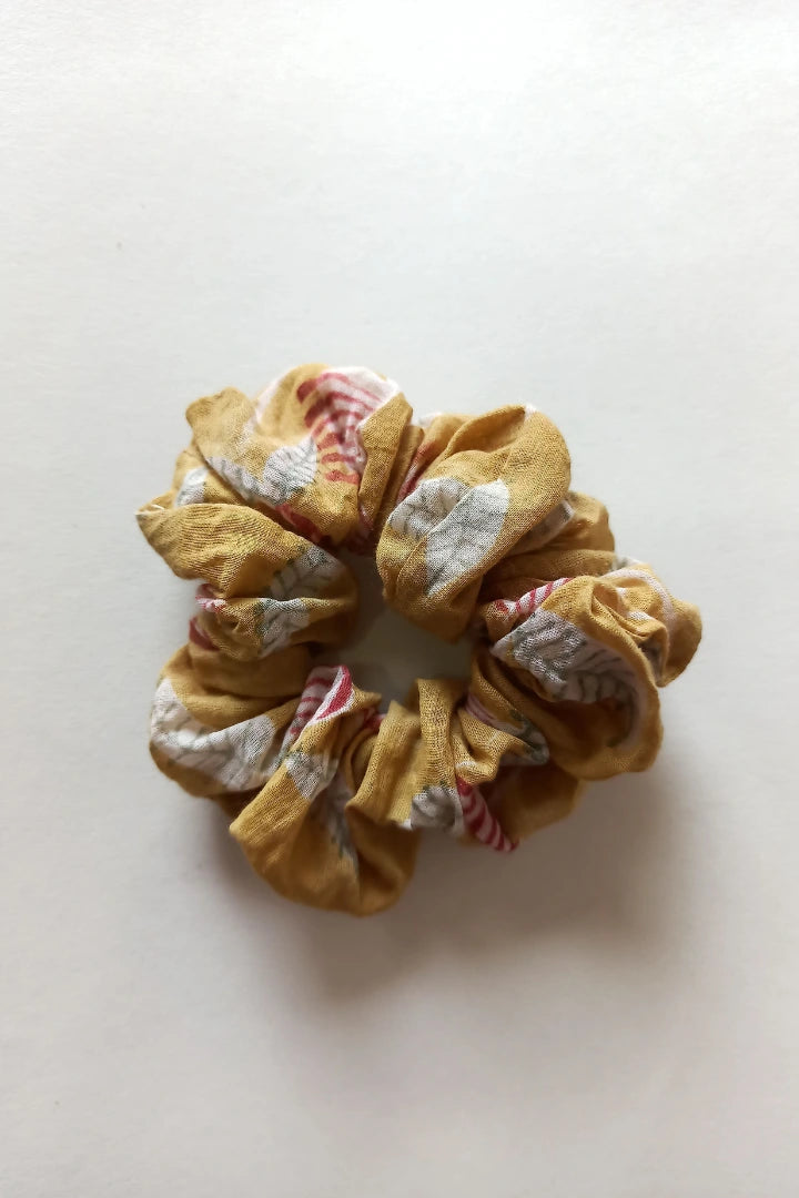 ilamra hand block printed naturally dyed organic cotton Mustard yellow, hints of dirty green and red upcycled cotton scrunchie