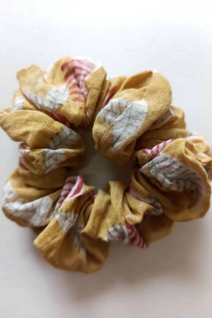 ilamra hand block printed naturally dyed organic cotton Mustard yellow, hints of dirty green and red upcycled cotton scrunchie