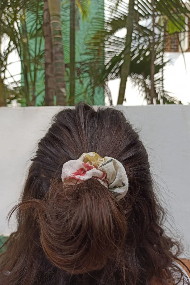 ilamra hand block printed naturally dyed organic cotton Off-white, hints of orange, blush pink, light green and dirty green upcycled cotton beautiful scrunchie