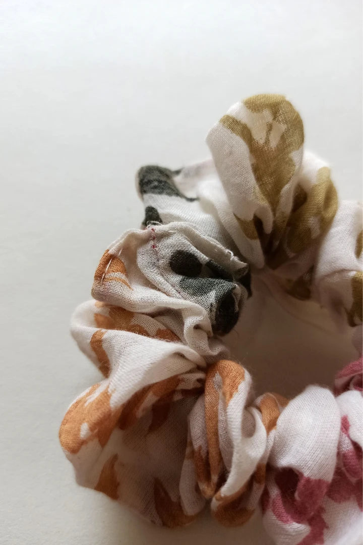 ilamra hand block printed naturally dyed organic cotton Off-white, hints of orange, blush pink, light green and dirty green upcycled cotton beautiful scrunchie