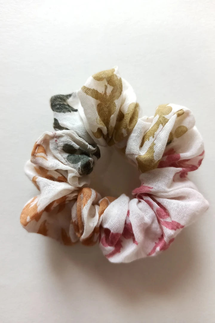 ilamra hand block printed naturally dyed organic cotton Off-white, hints of orange, blush pink, light green and dirty green upcycled cotton beautiful scrunchie