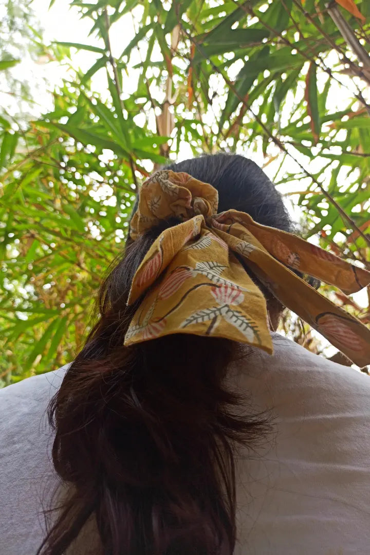 ilamra hand block printed naturally dyed organic cotton Mustard yellow, hints of dirty green and red upcycled cotton pastel shade scrunchie