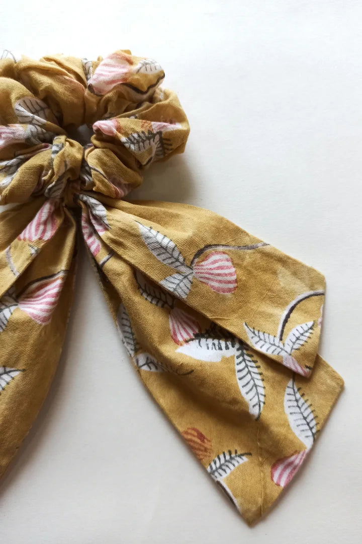 ilamra hand block printed naturally dyed organic cotton Mustard yellow, hints of dirty green and red upcycled cotton pastel shade scrunchie