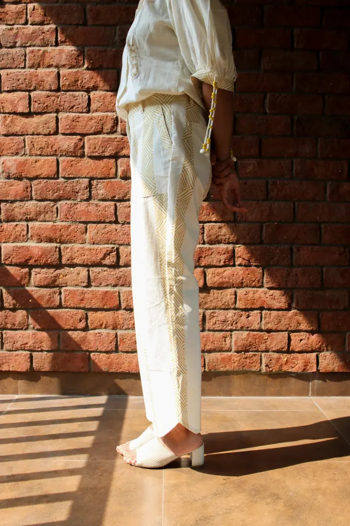 ilamra hand block printed naturally dyed organic cotton white pants with yellow print