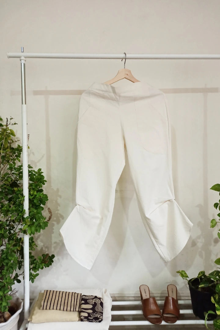 Ilamra kalamkari craft hand block printed organic cotton Off-white curved asymmetrical hem and are ruched at the bottom pants