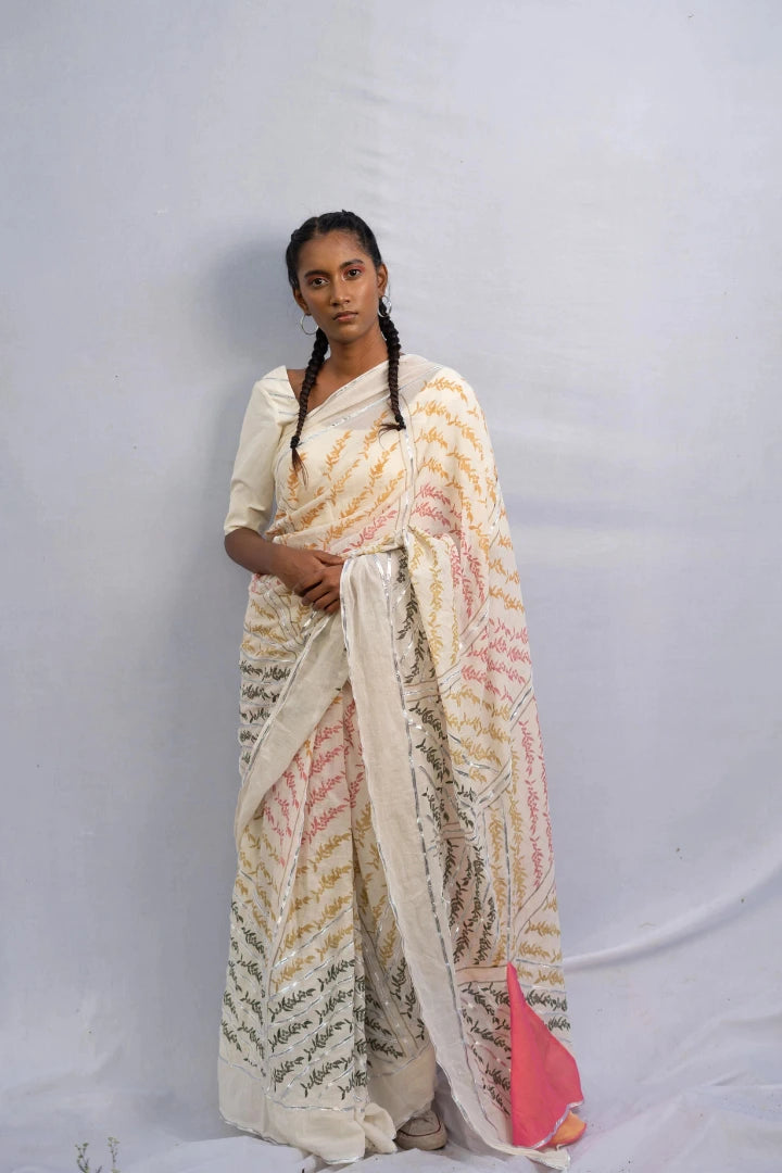 Ilamra kalamkari craft hand block printed organic cotton Pebble white base with orange, pink, lime green and dirty green motifs saree