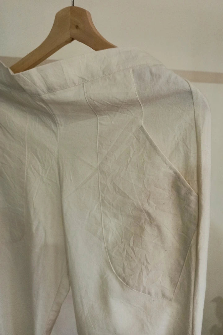 Ilamra kalamkari craft hand block printed organic cotton Off-white curved asymmetrical hem and are ruched at the bottom pants