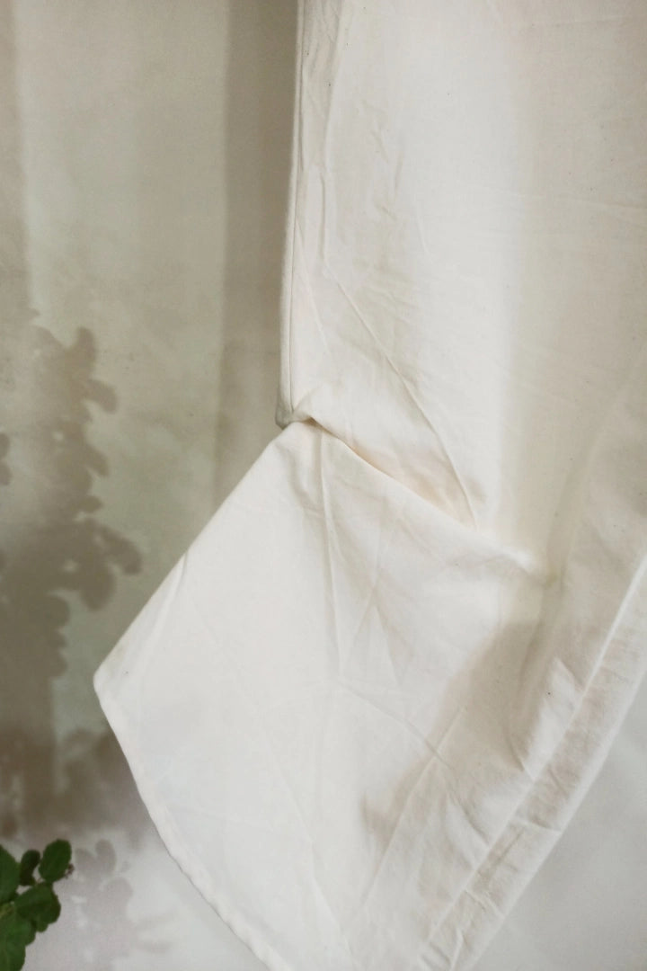 Ilamra kalamkari craft hand block printed organic cotton Off-white curved asymmetrical hem and are ruched at the bottom pants