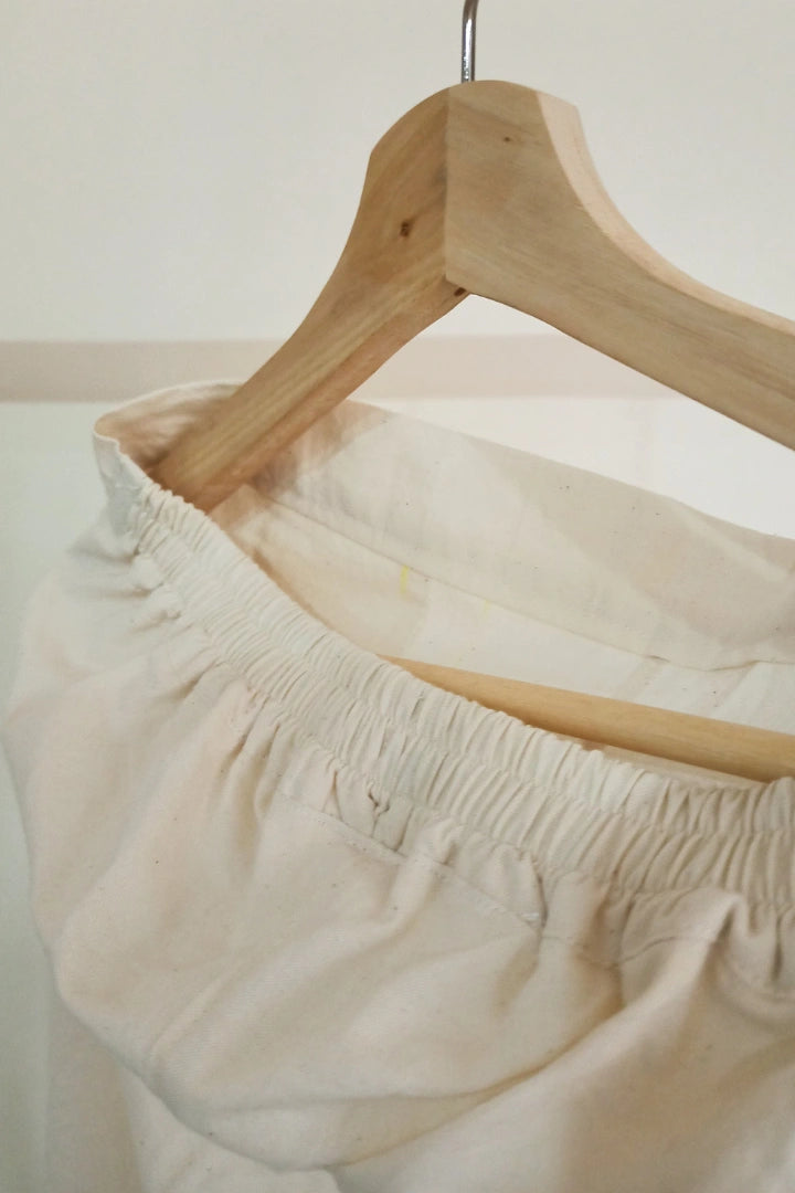 Ilamra kalamkari craft hand block printed organic cotton Off-white curved asymmetrical hem and are ruched at the bottom pants