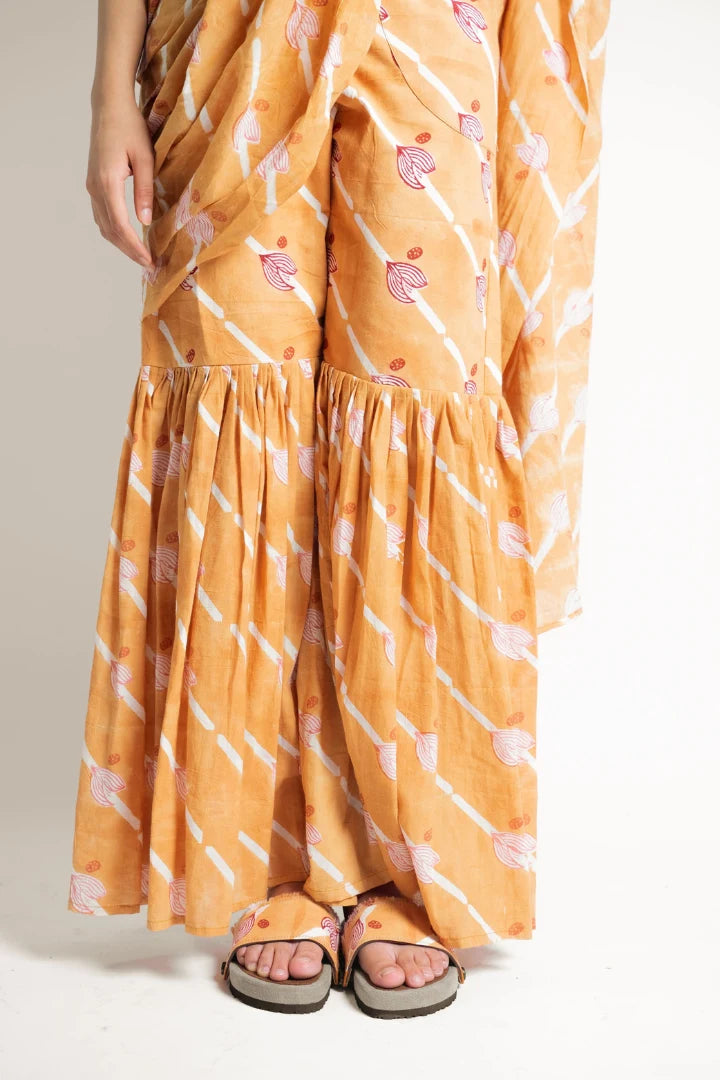 Ilamra hand block printed sustainably made naturally dyed Orange, Madder Red, and Off-White saree pants