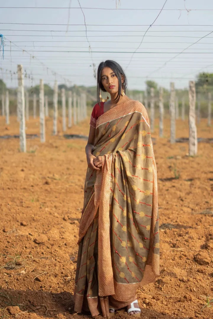 Ilamra kalamkari craft hand block printed organic cotton Brownish green base with a madder red border and beige motifs saree