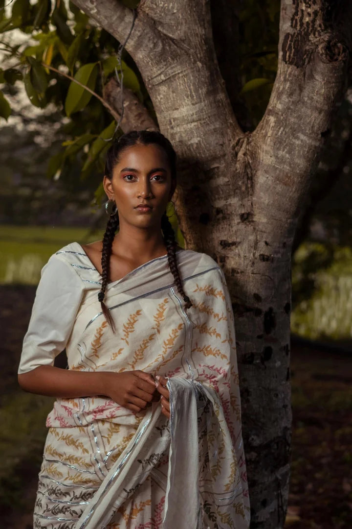 Ilamra kalamkari craft hand block printed organic cotton Pebble white base with orange, pink, lime green and dirty green motifs saree