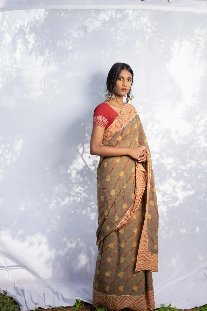 Ilamra kalamkari craft hand block printed organic cotton Brownish green base with a madder red border and beige motifs saree