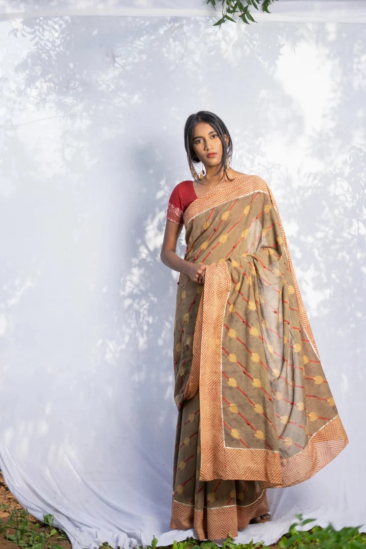 Ilamra kalamkari craft hand block printed organic cotton Brownish green base with a madder red border and beige motifs saree