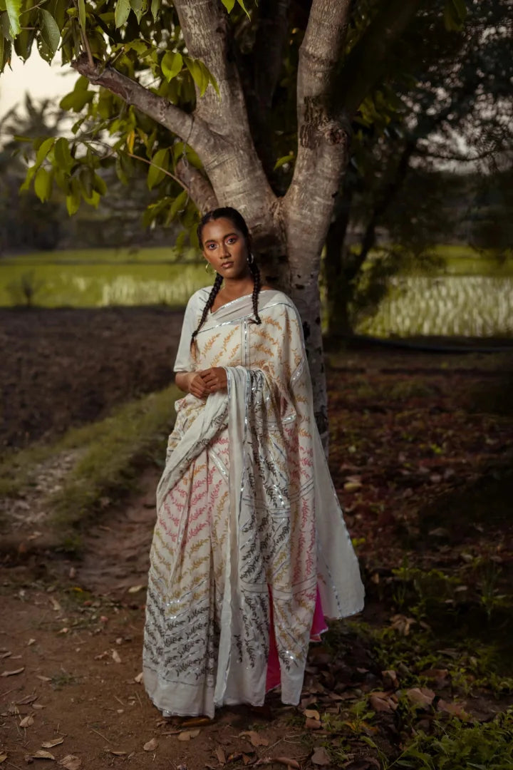 Ilamra kalamkari craft hand block printed organic cotton Pebble white base with orange, pink, lime green and dirty green motifs saree