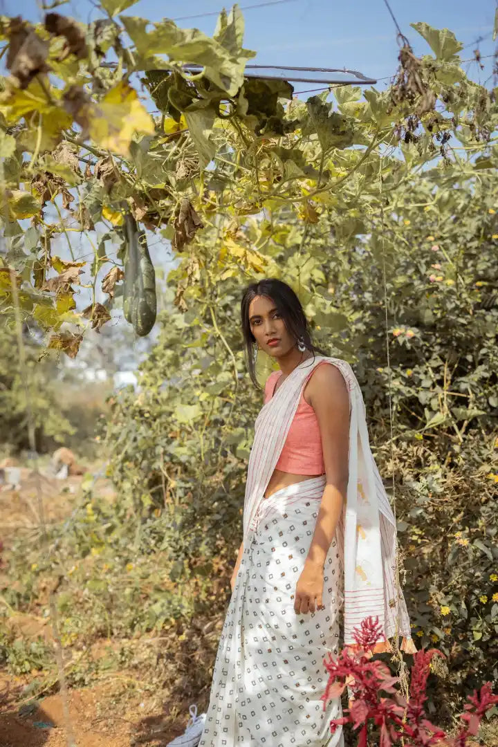 Ilamra kalamkari craft hand block printed organic cotton Pebble white saree with Madder red, black and mustard yellow detailing saree