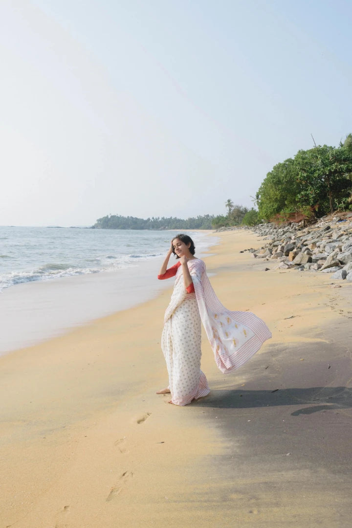 Ilamra kalamkari craft hand block printed organic cotton Pebble white saree with Madder red, black and mustard yellow detailing saree