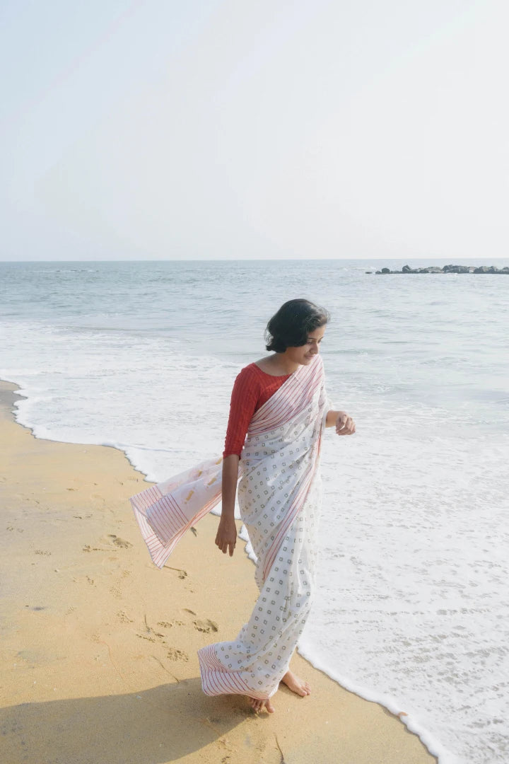 Ilamra kalamkari craft hand block printed organic cotton Pebble white saree with Madder red, black and mustard yellow detailing saree
