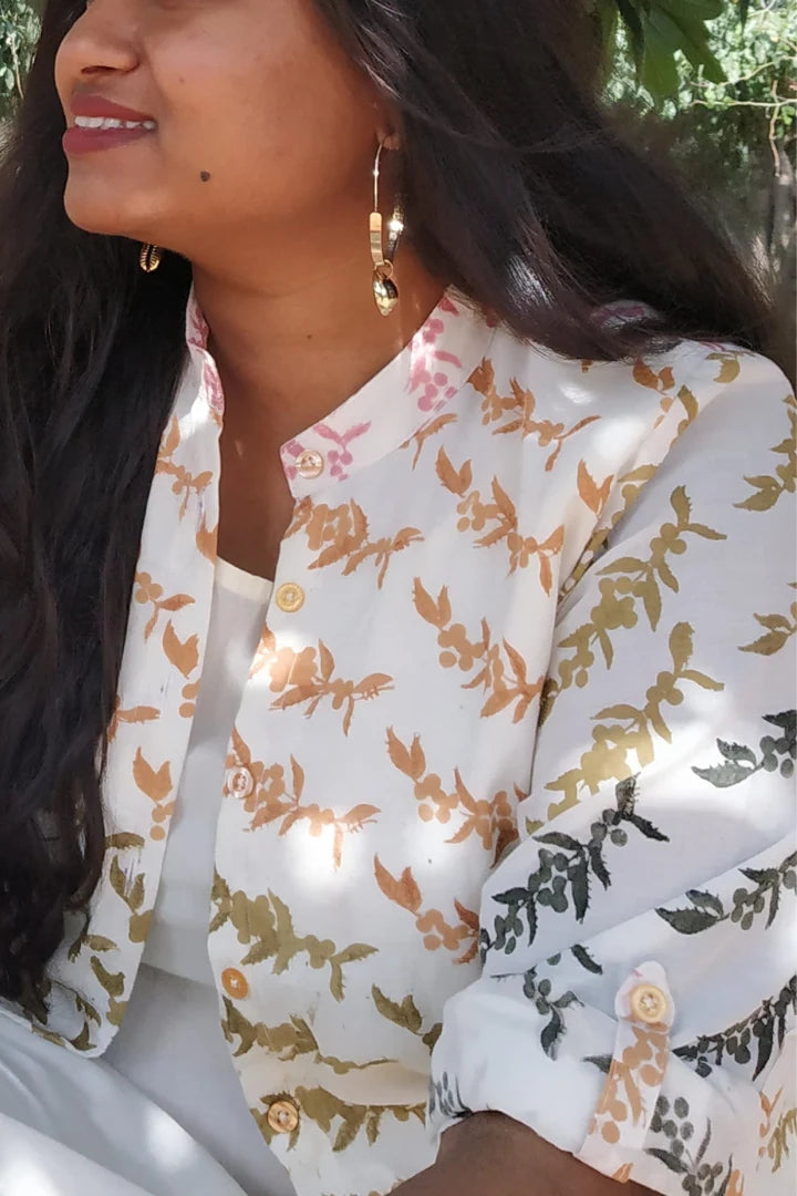 Ilamra hand block printed sustainably made naturally dyed Pebble white base with orange, pink, lime green and dirty green motifs peppercorn print jacket