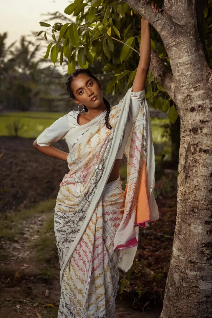 Ilamra kalamkari craft hand block printed organic cotton Pebble white base with orange, pink, lime green and dirty green motifs saree