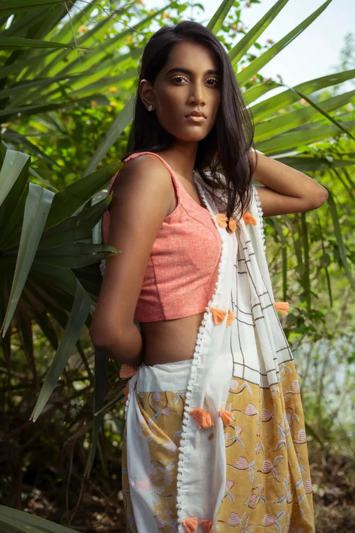 Ilamra kalamkari craft hand block printed organic cotton Mustard yellow with black, red and peach detailing over a pebble white base saree