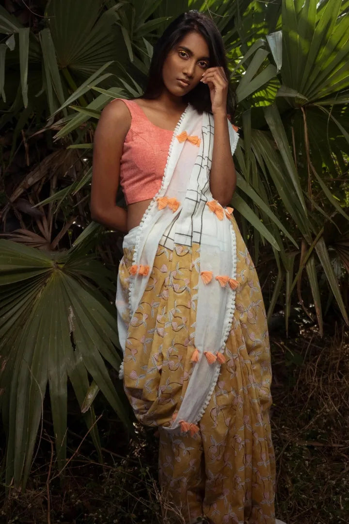 Ilamra kalamkari craft hand block printed organic cotton Mustard yellow with black, red and peach detailing over a pebble white base saree