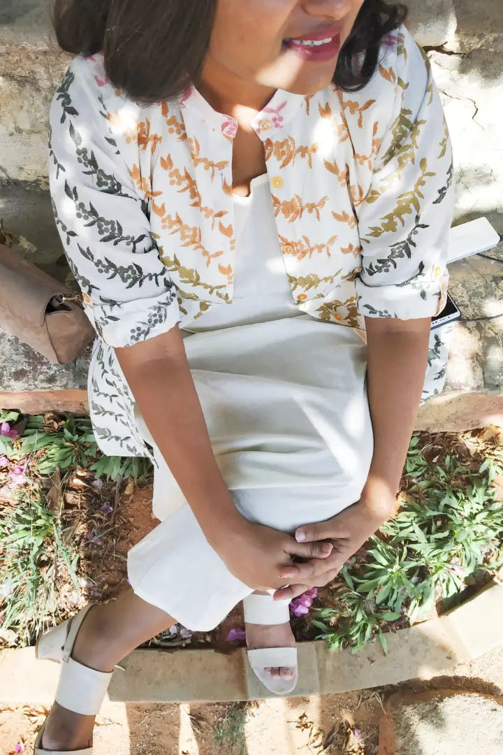 Ilamra hand block printed sustainably made naturally dyed Pebble white base with orange, pink, lime green and dirty green motifs peppercorn print jacket