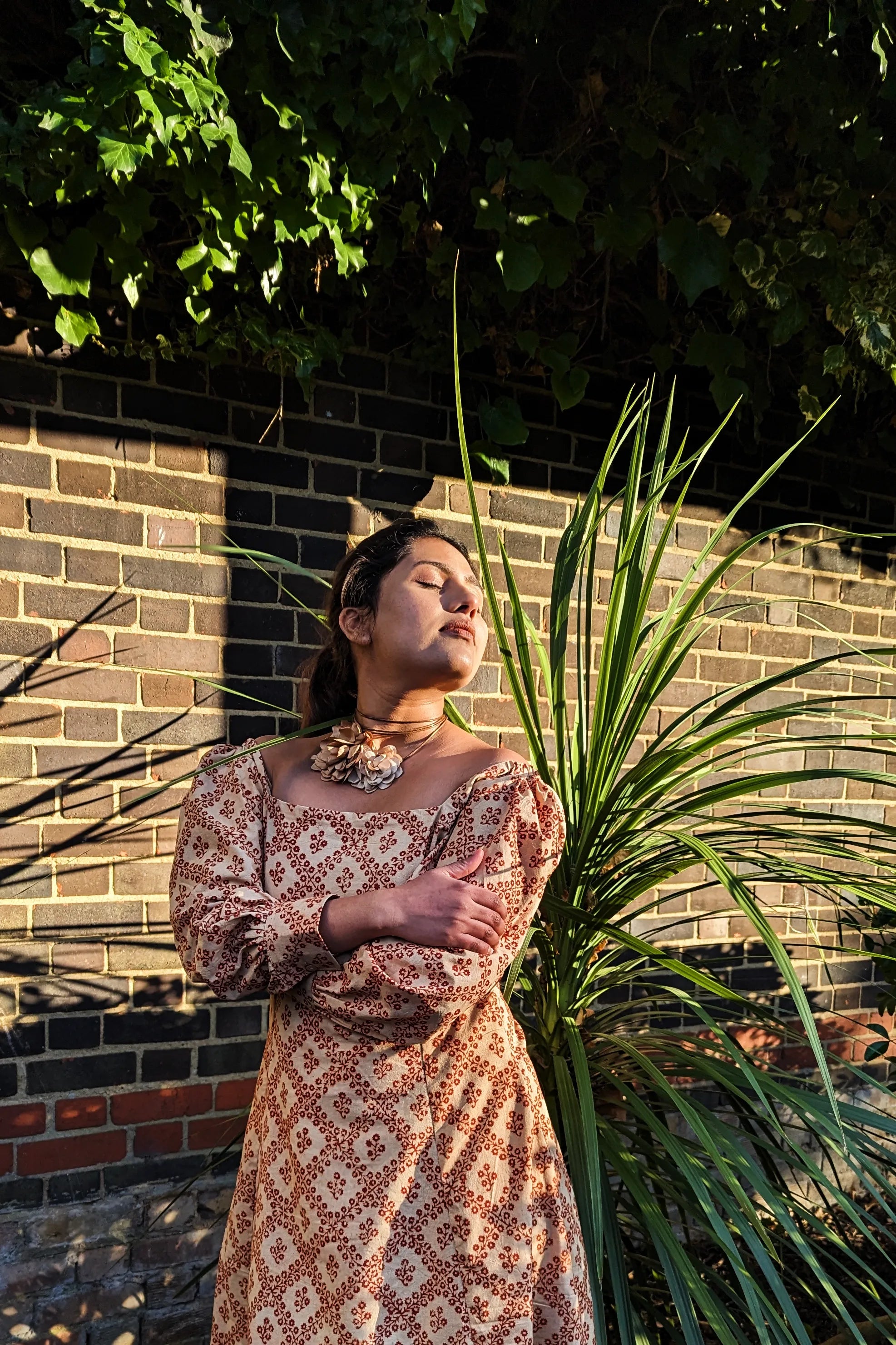 Ilamra hand block printed Kalamkari art organic cotton naturally dyed in Madder red against a beige background, big sleeves, elegant, classy, chic dress