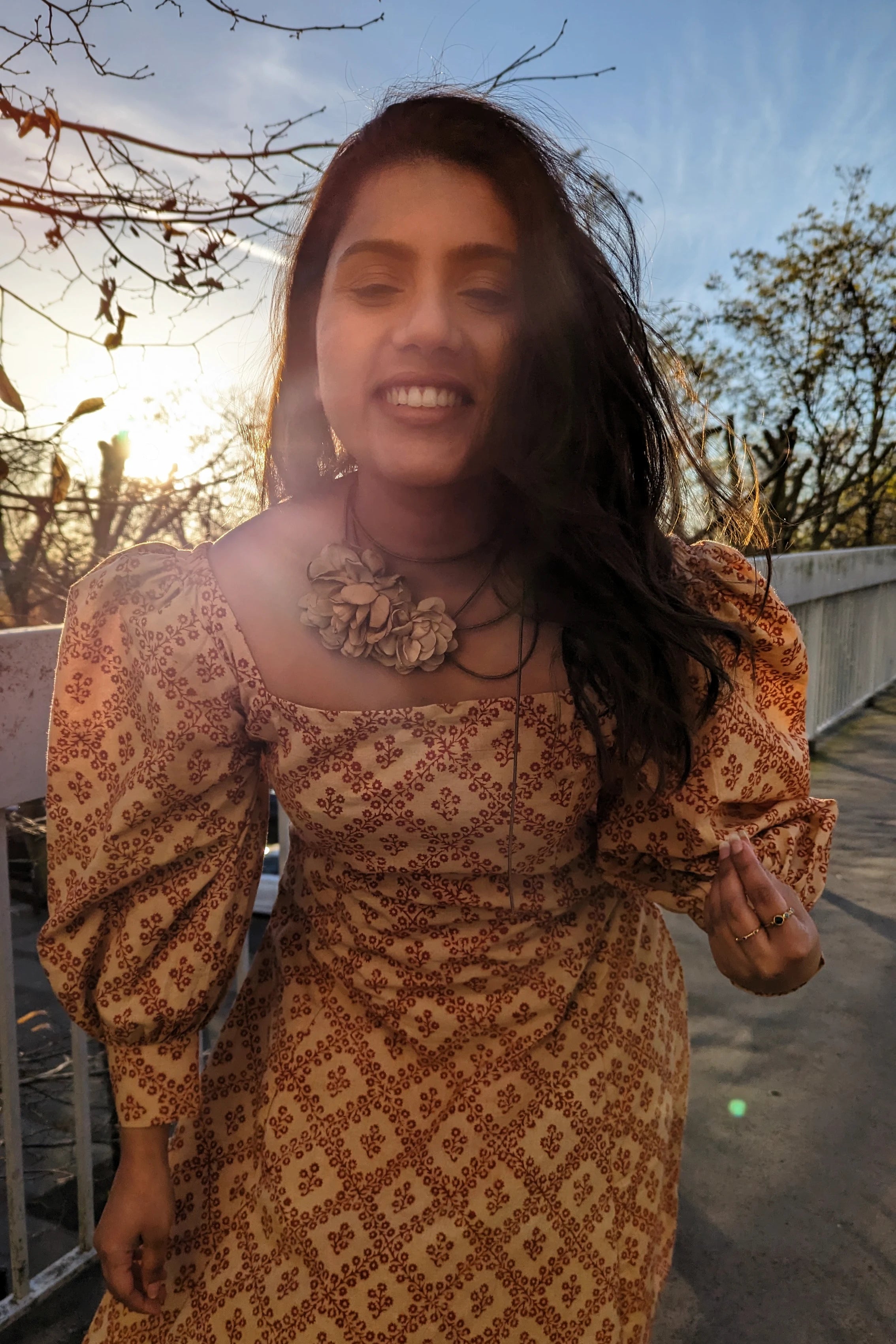 Ilamra hand block printed Kalamkari art organic cotton naturally dyed in Madder red against a beige background, big sleeves, elegant, classy, chic dress