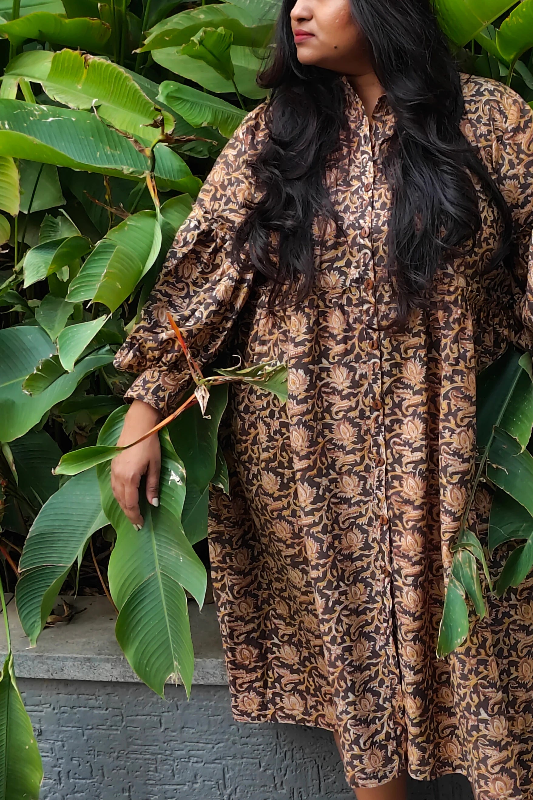 Ilamra hand block printed Kalamkari art organic cotton naturally dyed black, hazel, and beige, ruffle detailing, balloon sleeves ending in cuffs, calf-length dress