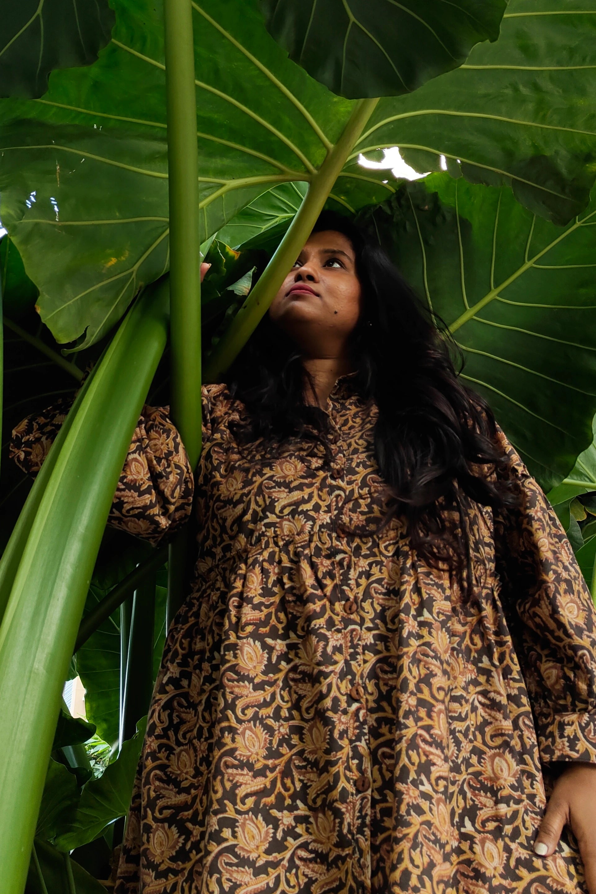 Ilamra hand block printed Kalamkari art organic cotton naturally dyed black, hazel, and beige, ruffle detailing, balloon sleeves ending in cuffs, calf-length dress