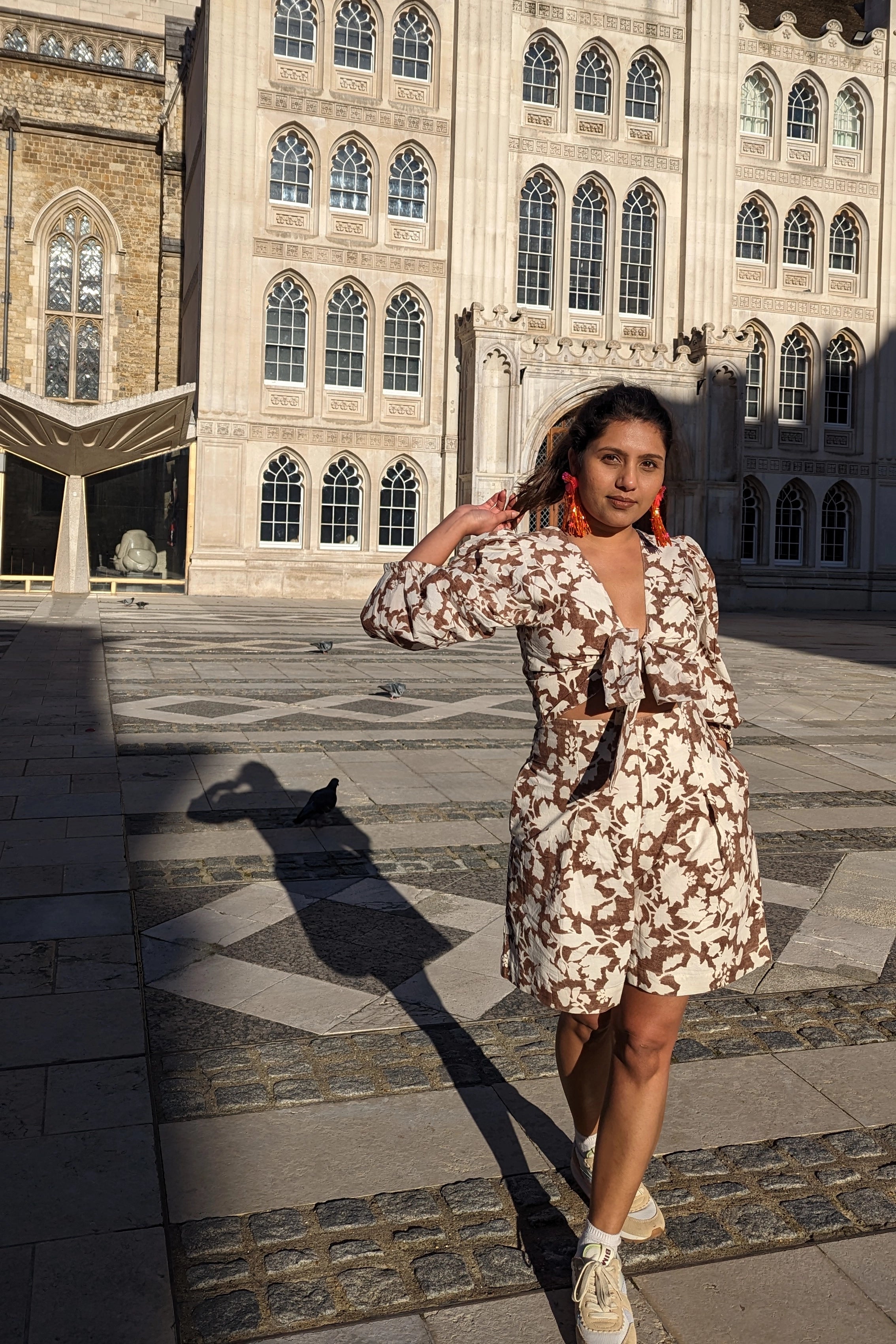 Ilamra hand block printed Kalamkari art organic cotton naturally dyed in deep cocoa brown on a pale white background, plunging neckline, wrist length sleeves, classy, cool, tie up puff top