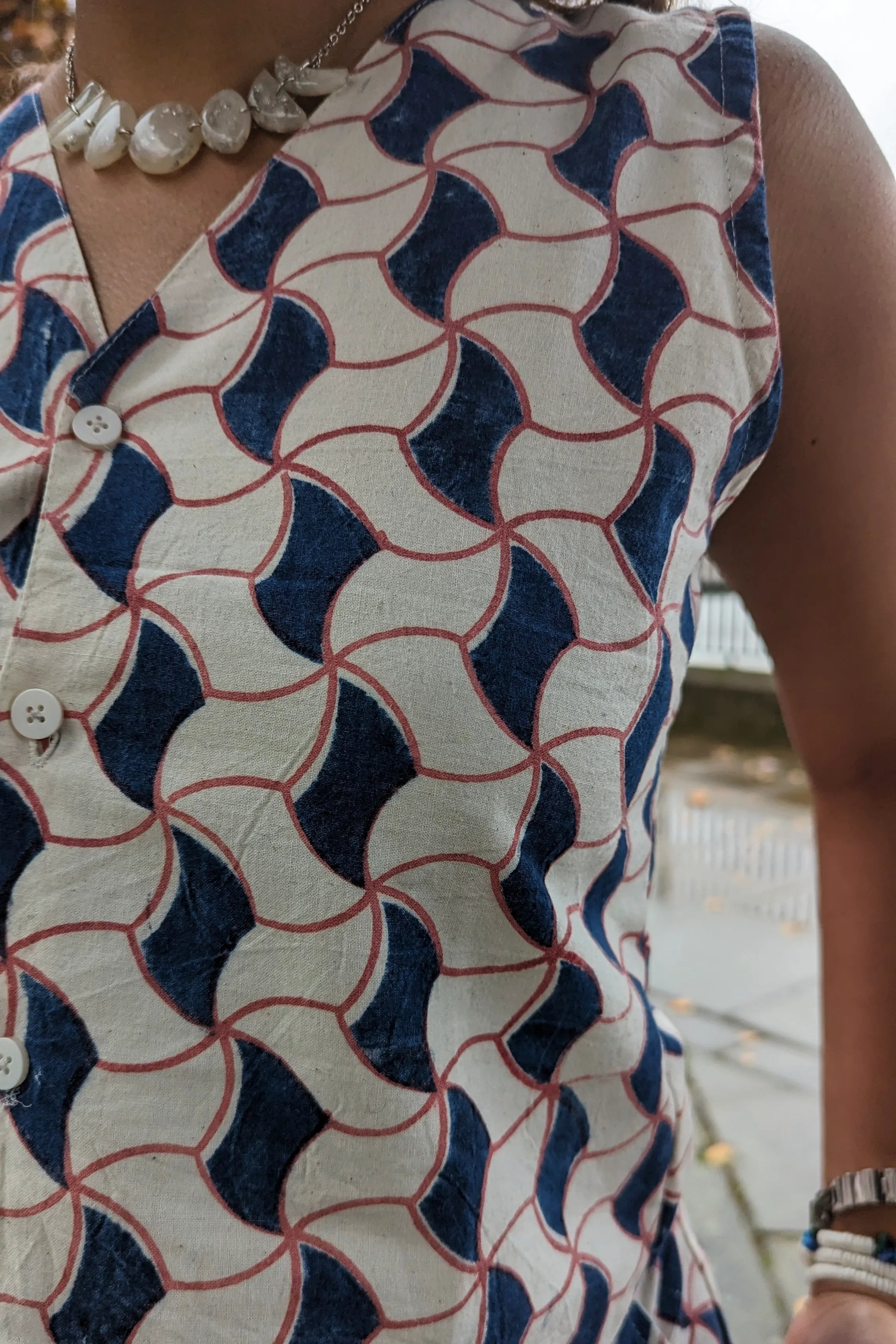 Ilamra hand block printed Kalamkari art organic cotton naturally dyed sharp v-neck and button-down fastening, fitted vest and relaxed pants.