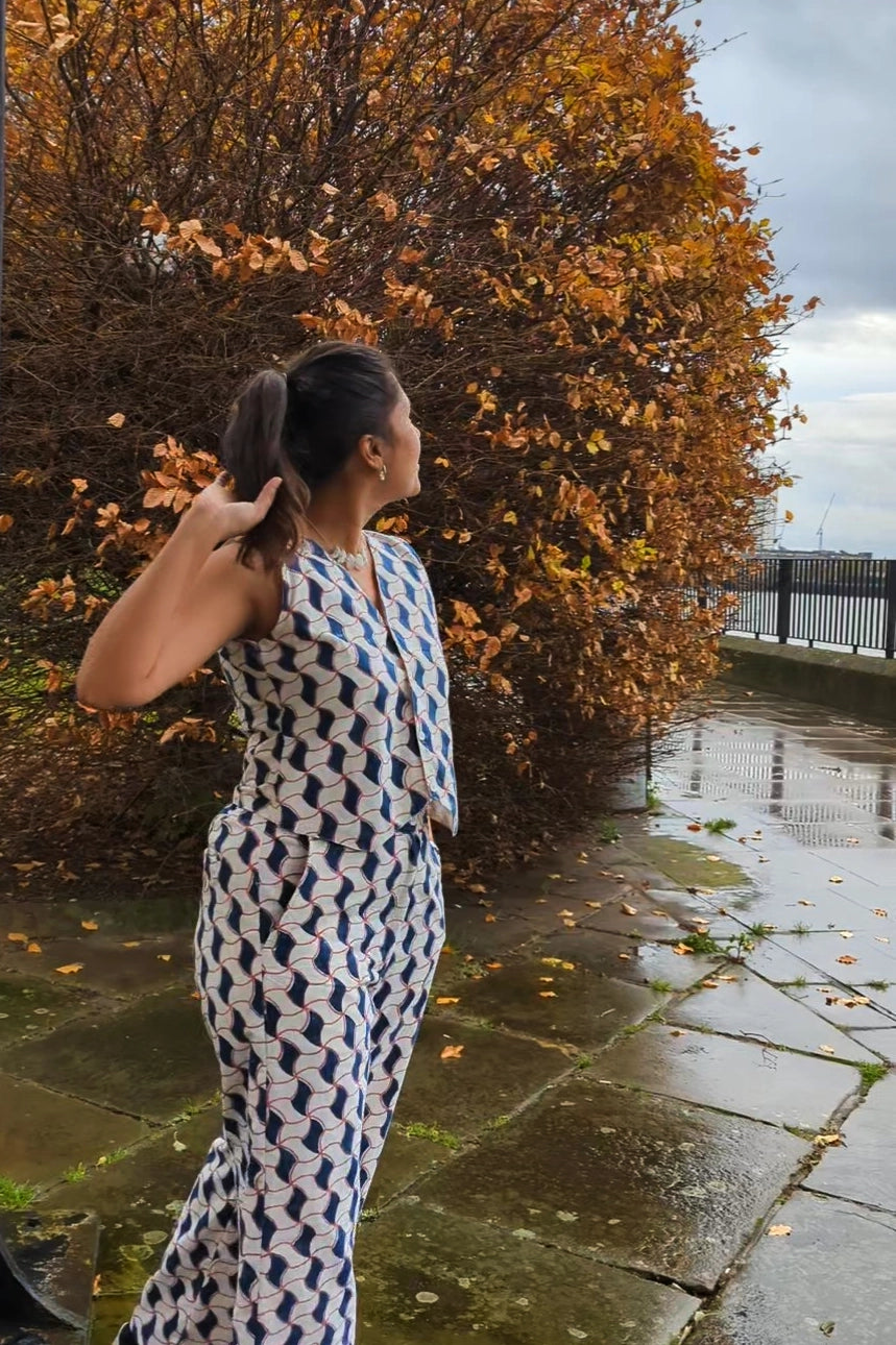 Ilamra hand block printed Kalamkari art organic cotton naturally dyed sharp v-neck and button-down fastening, fitted vest and relaxed pants.