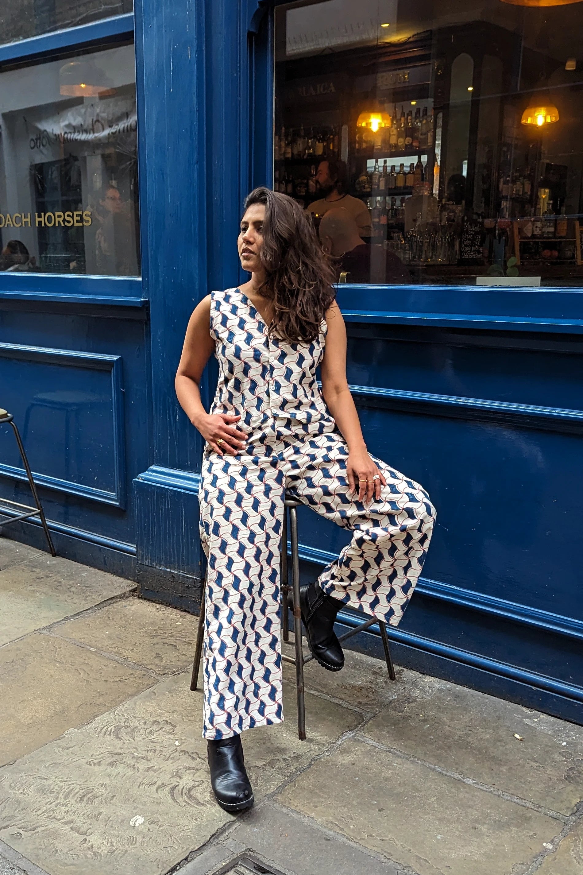 Ilamra hand block printed Kalamkari art organic cotton naturally dyed sharp v-neck and button-down fastening, fitted vest and relaxed pants.