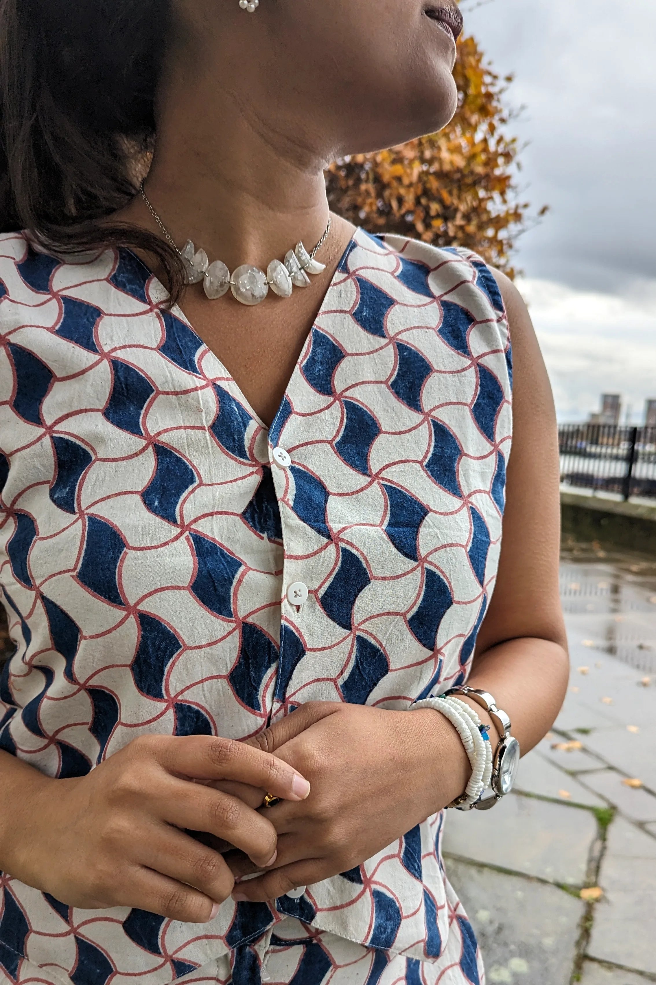 Ilamra hand block printed Kalamkari art organic cotton naturally dyed sharp v-neck and button-down fastening, fitted vest and relaxed pants.