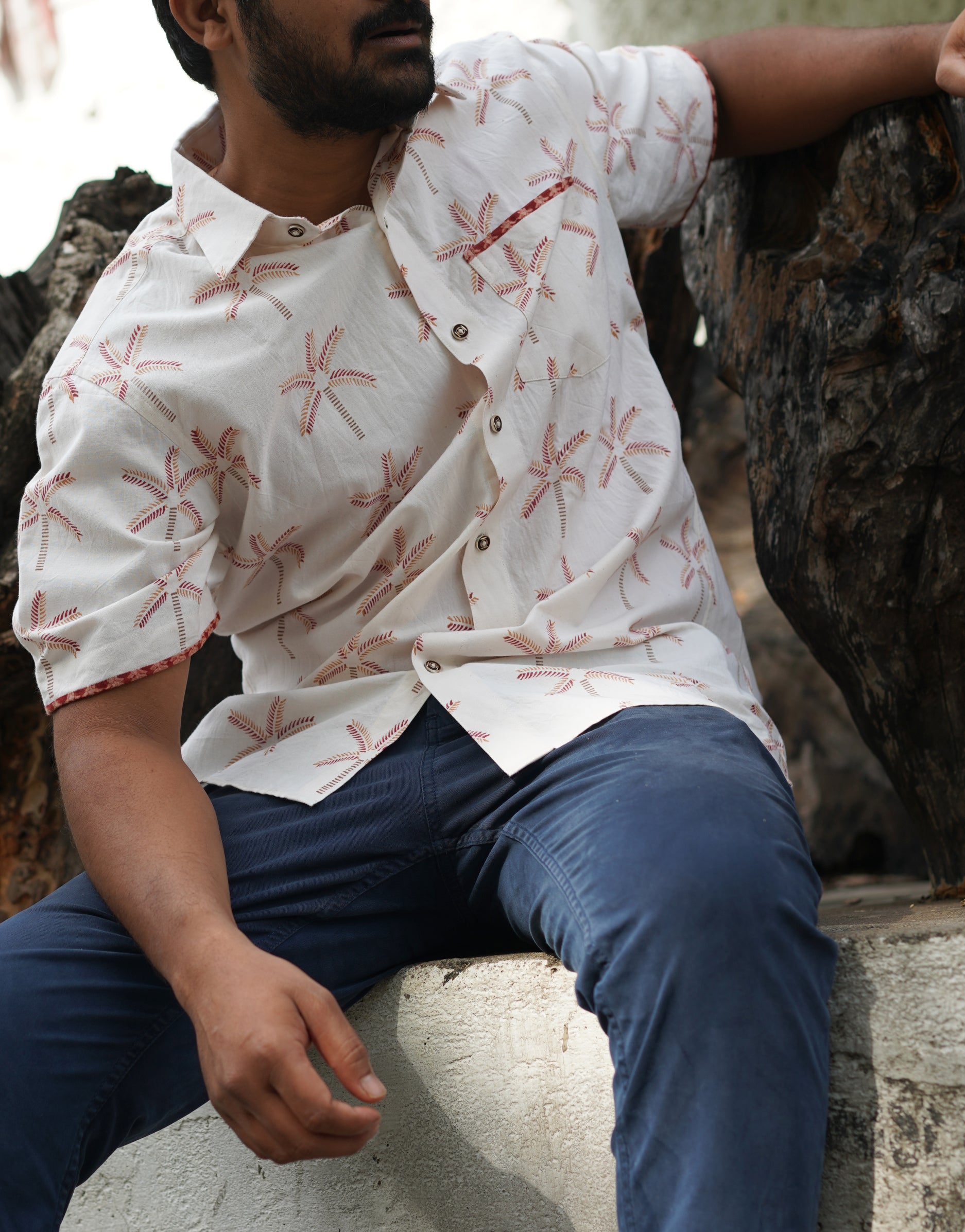 Men's Half sleeve shirt featuring hand block printed coconut motifs un the shades of beige and madder red.