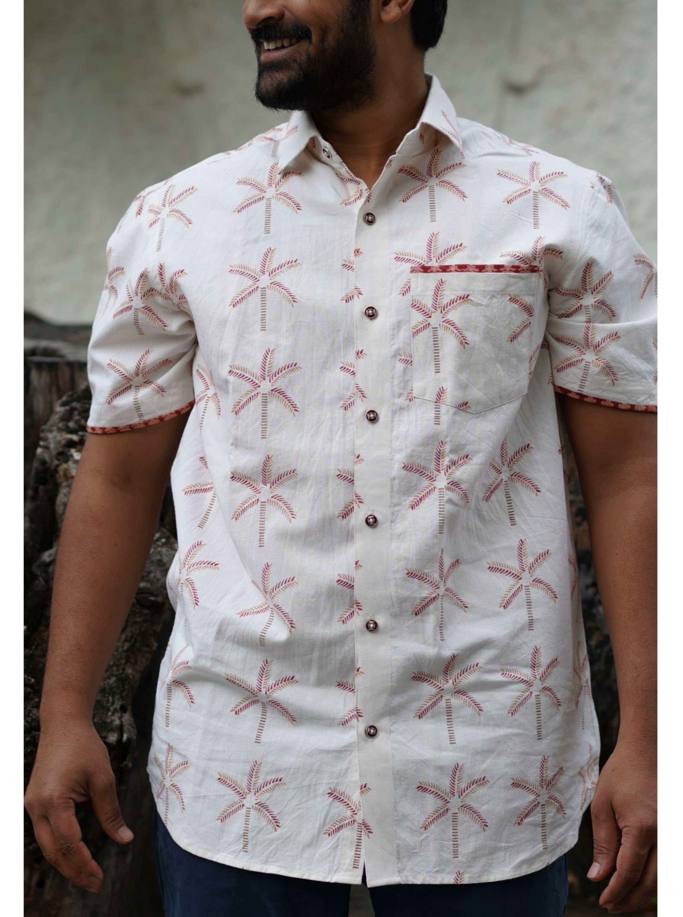 Men's Half sleeve shirt featuring hand block printed coconut motifs un the shades of beige and madder red.