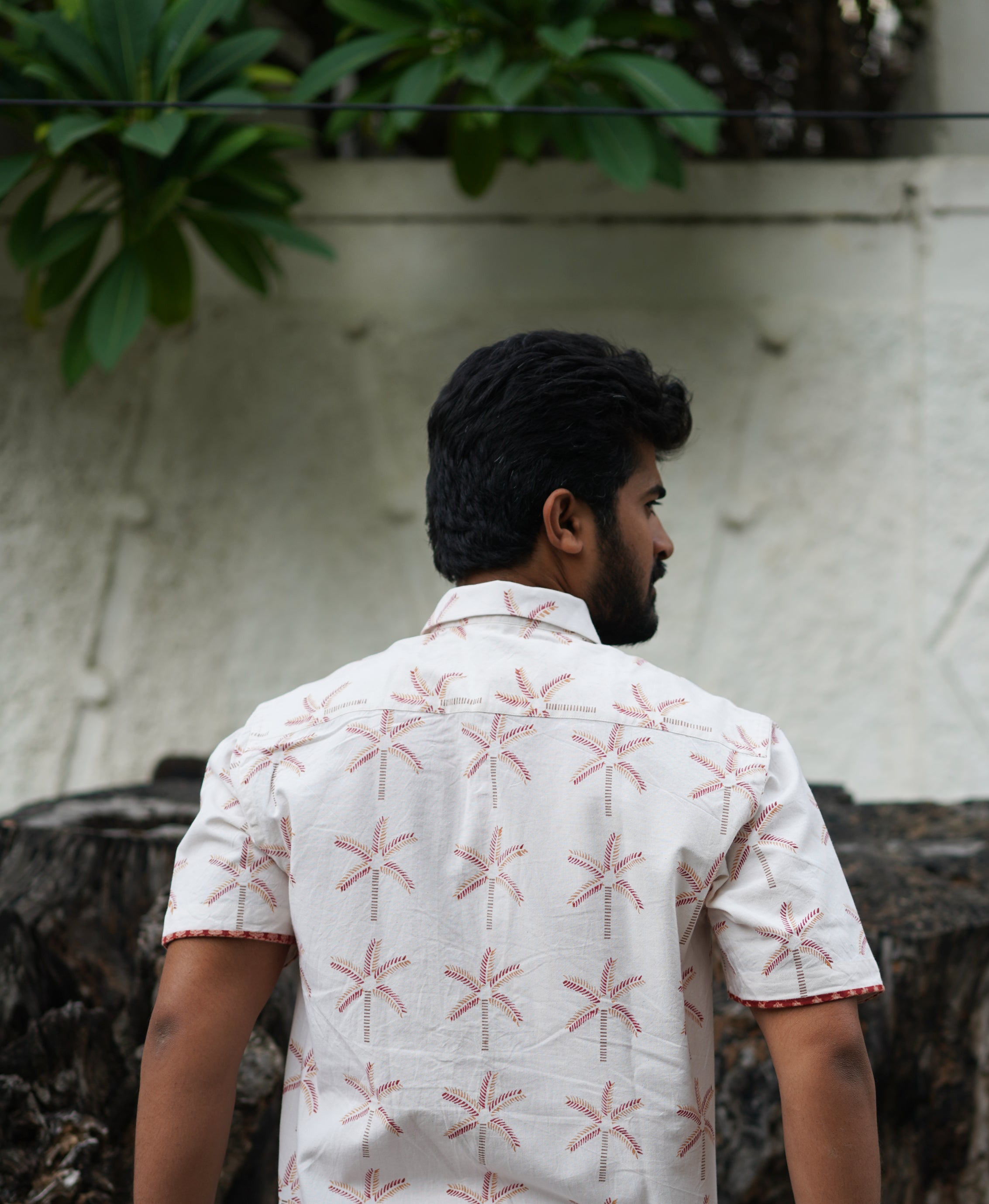 Men's Half sleeve shirt featuring hand block printed coconut motifs un the shades of beige and madder red.