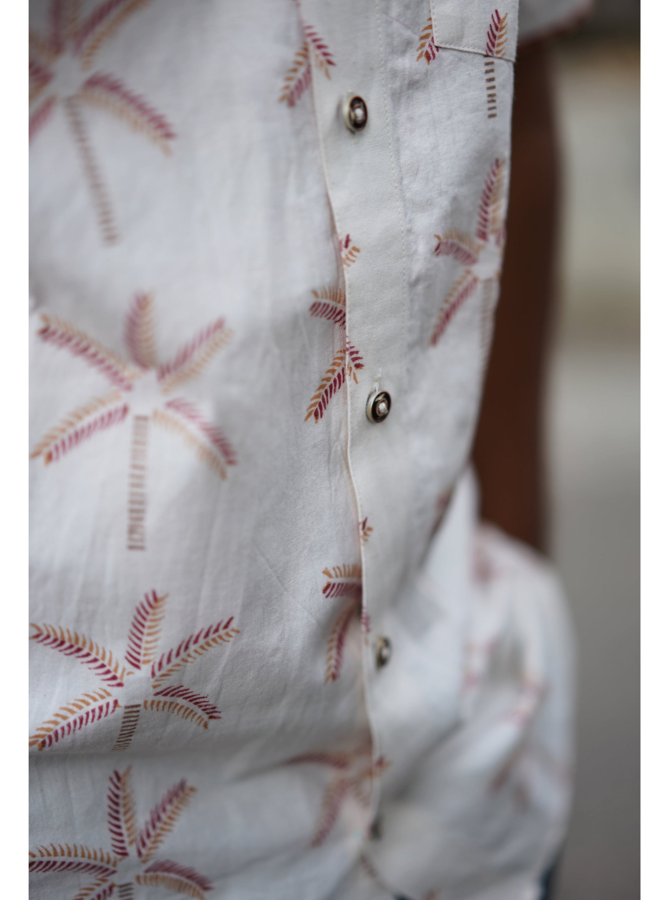 Men's Half sleeve shirt featuring hand block printed coconut motifs un the shades of beige and madder red.