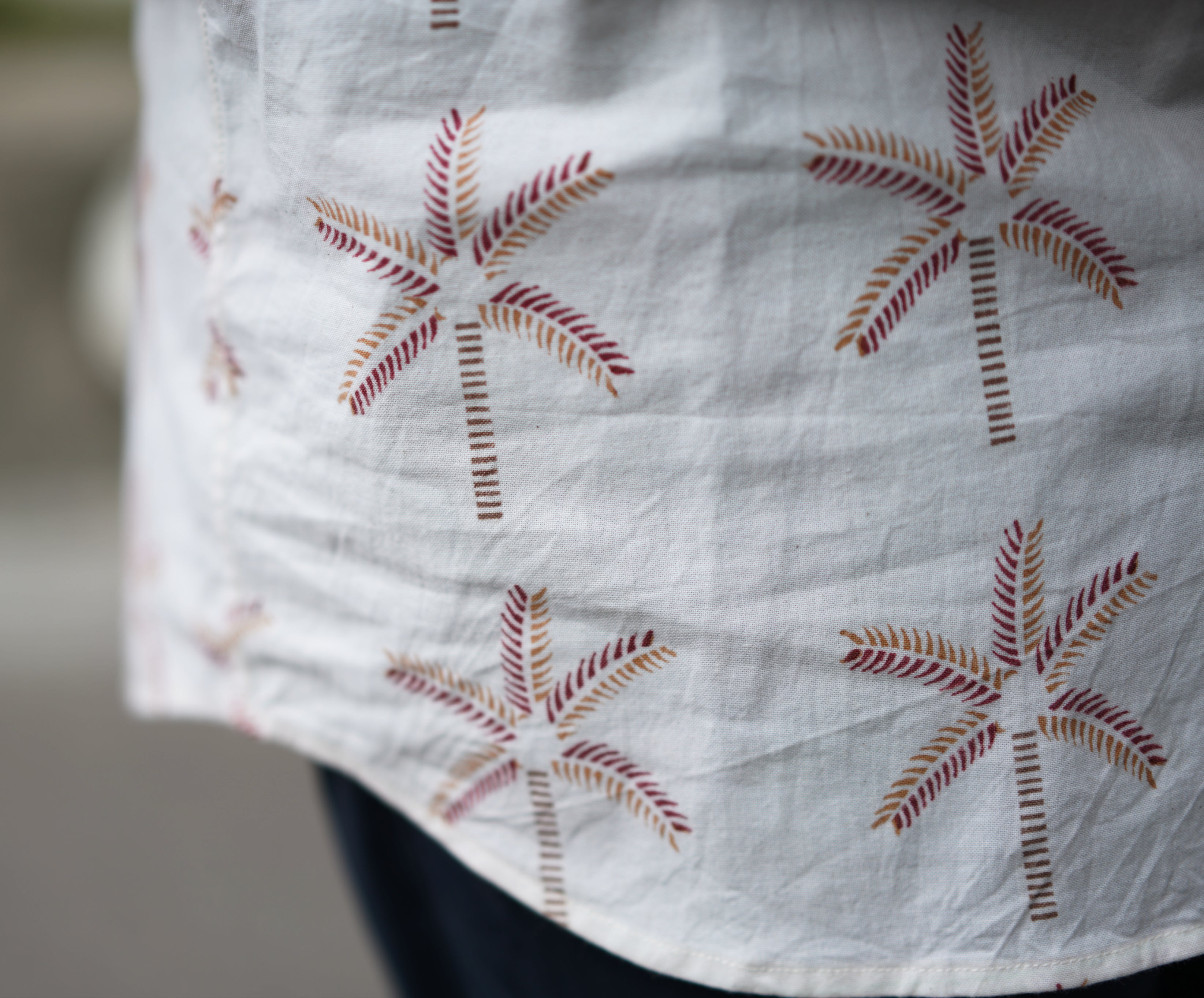 Men's Half sleeve shirt featuring hand block printed coconut motifs un the shades of beige and madder red.
