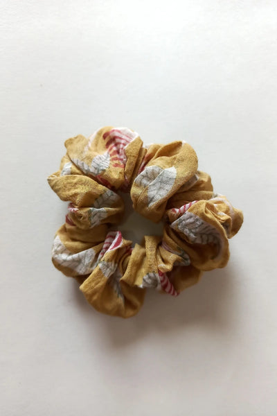 ilamra hand block printed naturally dyed organic cotton Mustard yellow, hints of dirty green and red upcycled cotton scrunchie