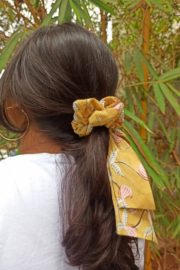 ilamra hand block printed naturally dyed organic cotton Mustard yellow, hints of dirty green and red upcycled cotton pastel shade scrunchie