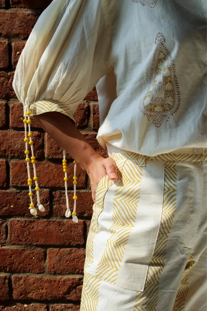 ilamra hand block printed naturally dyed organic cotton white pants with yellow print