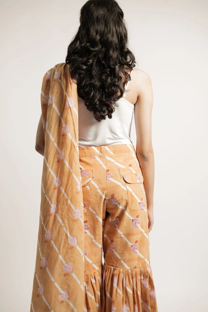 Ilamra hand block printed sustainably made naturally dyed Orange, Madder Red, and Off-White saree pants