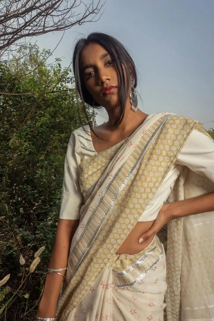 Ilamra kalamkari craft hand block printed organic cotton Pebble white base with an olive green border and silver detailing saree