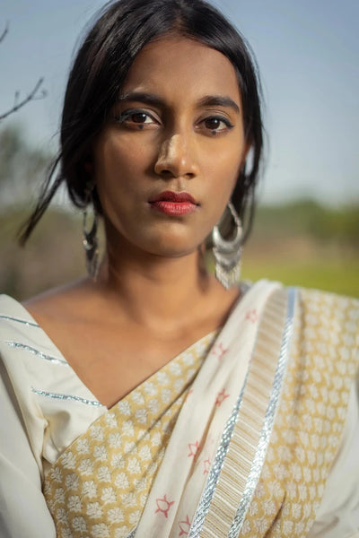 Ilamra kalamkari craft hand block printed organic cotton Pebble white base with an olive green border and silver detailing saree