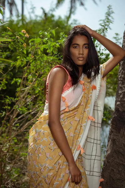 Ilamra kalamkari craft hand block printed organic cotton Mustard yellow with black, red and peach detailing over a pebble white base saree